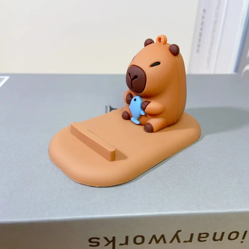 Diseño creativo de lindas figuras de capibara, soporte para teléfono de escritorio, soporte para persona perezosa, regalos decorativos creativos