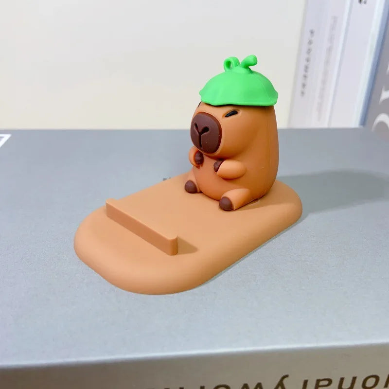 Diseño creativo de lindas figuras de capibara, soporte para teléfono de escritorio, soporte para persona perezosa, regalos decorativos creativos