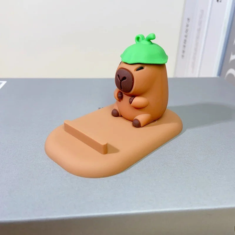 Diseño creativo de lindas figuras de capibara, soporte para teléfono de escritorio, soporte para persona perezosa, regalos decorativos creativos